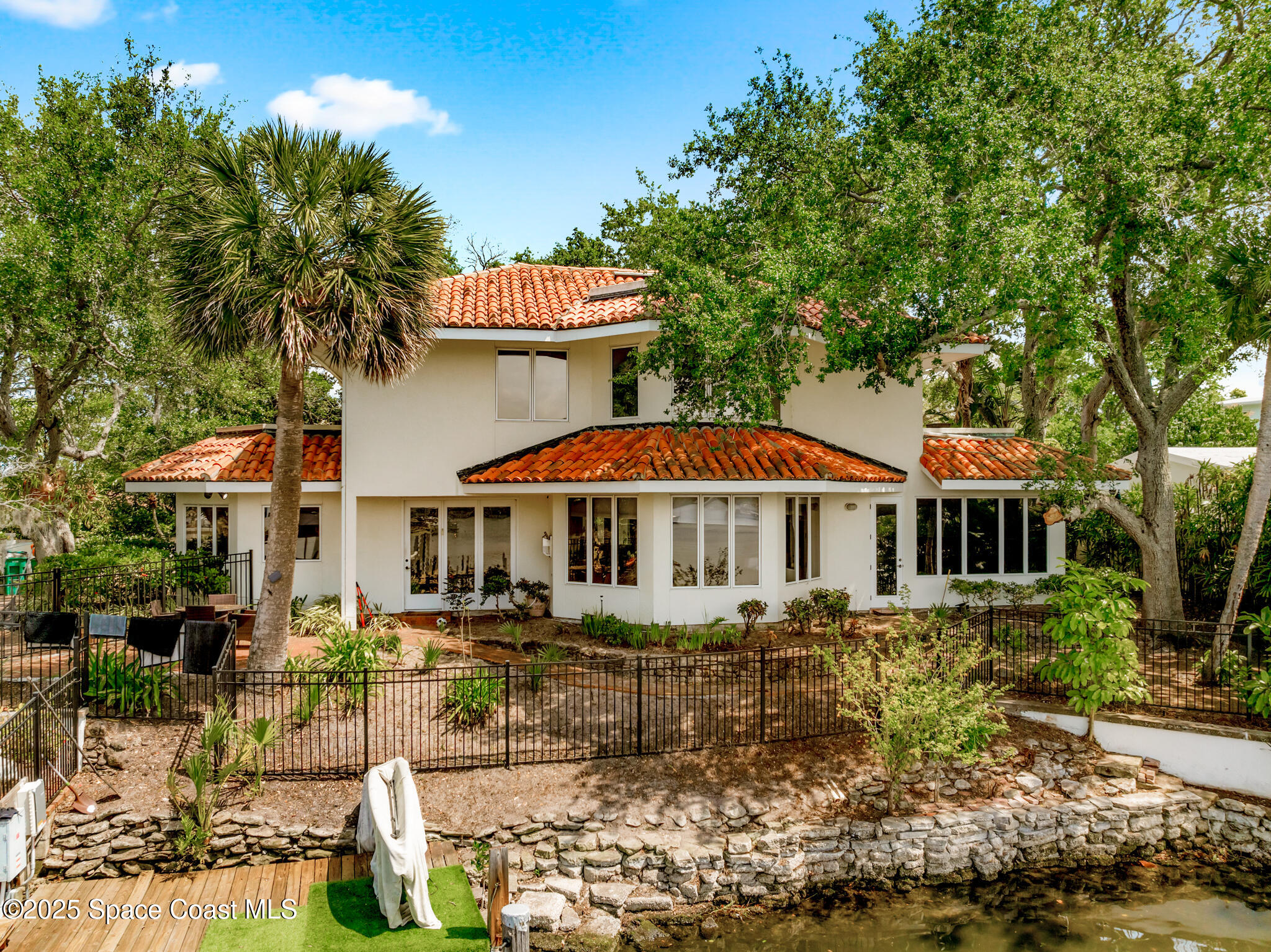 1025 Terry Drive Melbourne, FL 32935 - Photo 4 of 72 a front view of a house with yard and trees