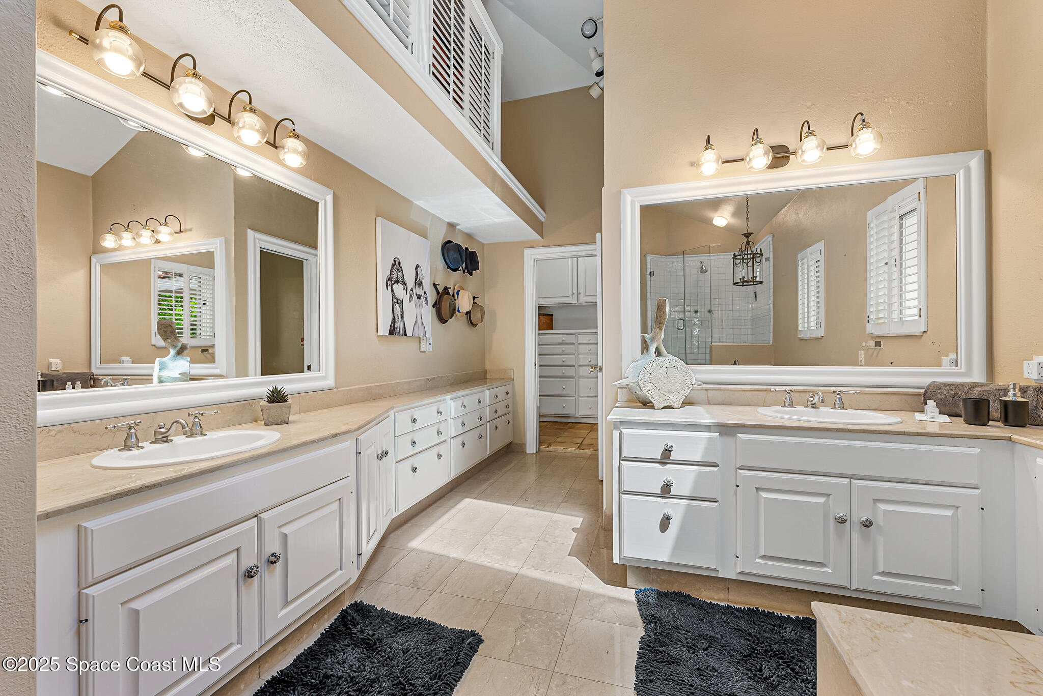 1025 Terry Drive Melbourne, FL 32935 - Photo 44 of 72 a spacious bathroom with a double vanity sink mirror and