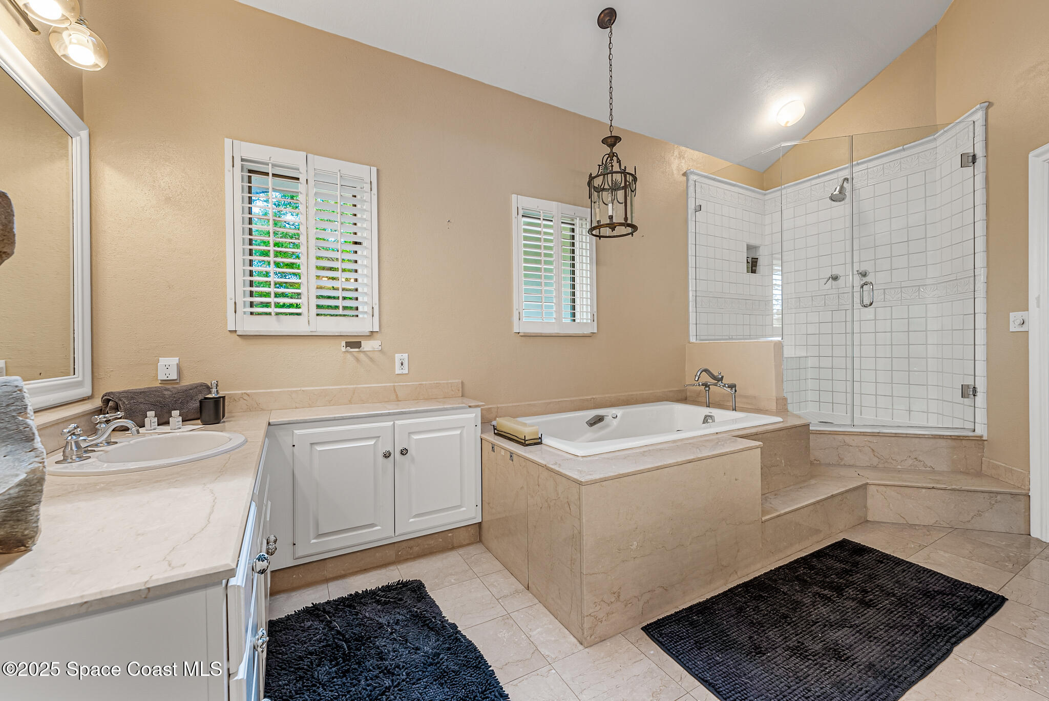 1025 Terry Drive Melbourne, FL 32935 - Photo 45 of 72 a bathroom with a sink toilet and shower