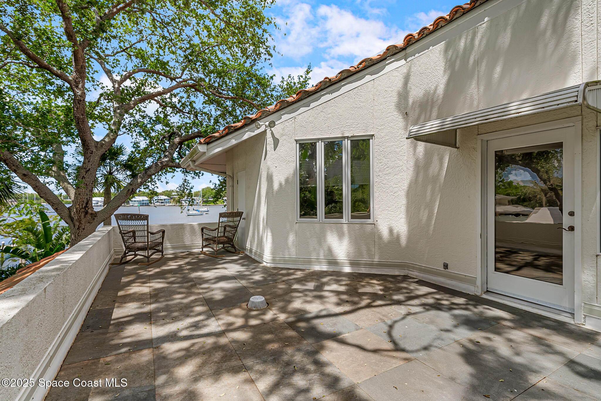 1025 Terry Drive Melbourne, FL 32935 - Photo 50 of 72 a view of a house with backyard and sitting area