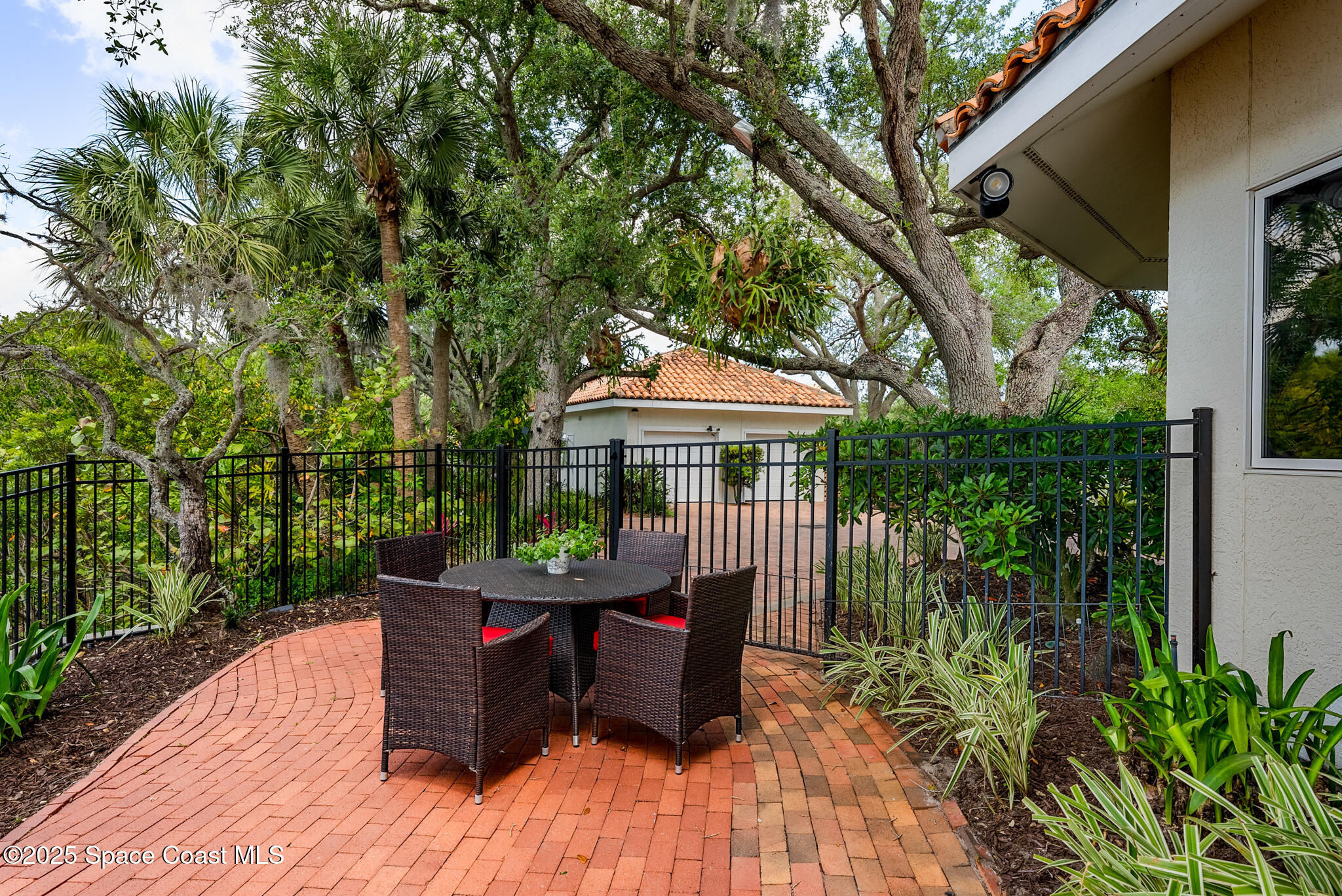 1025 Terry Drive Melbourne, FL 32935 - Photo 58 of 72 a roof deck with table and chairs and potted plants