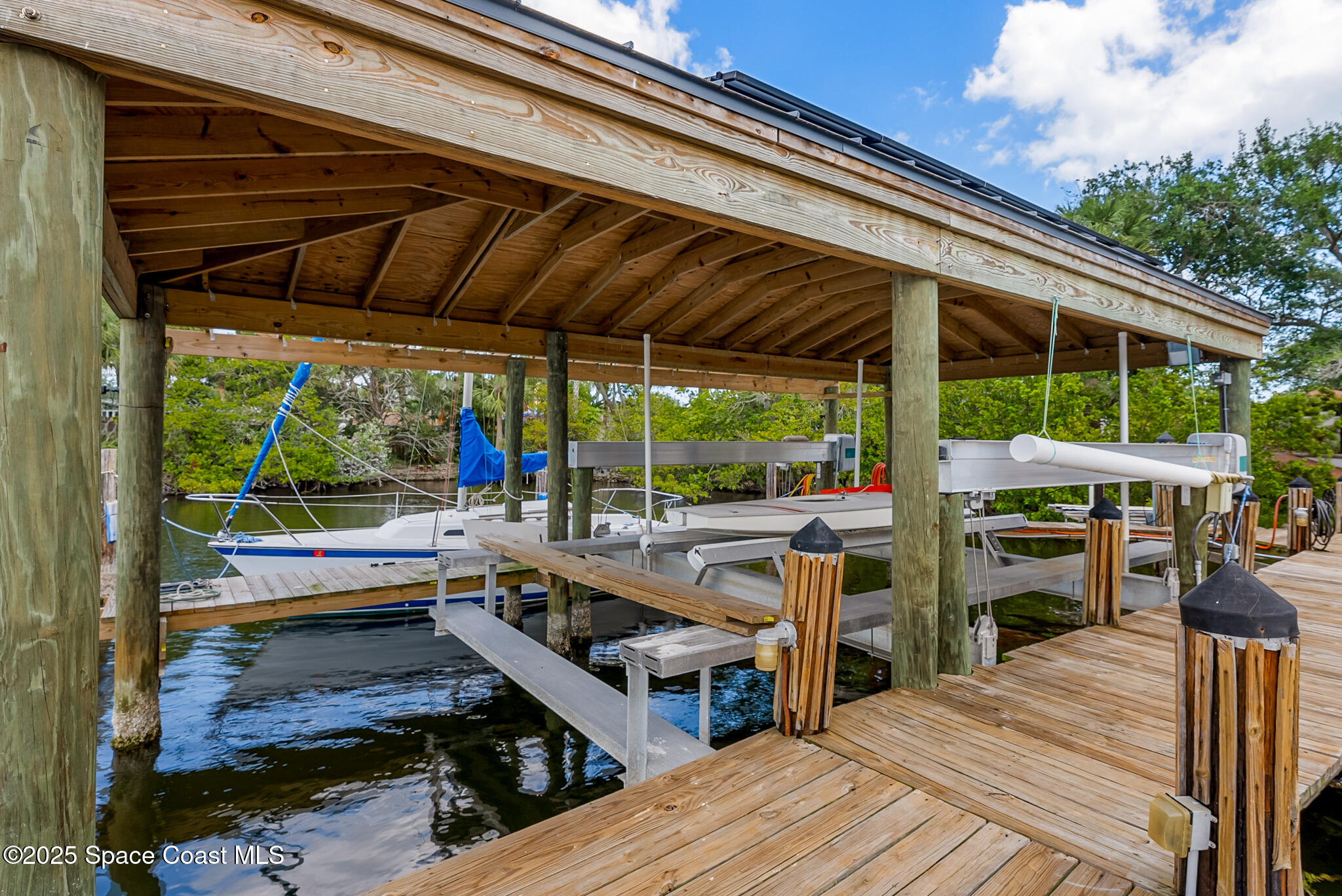 1025 Terry Drive Melbourne, FL 32935 - Photo 61 of 72 a view of a patio with chairs and wooden floor