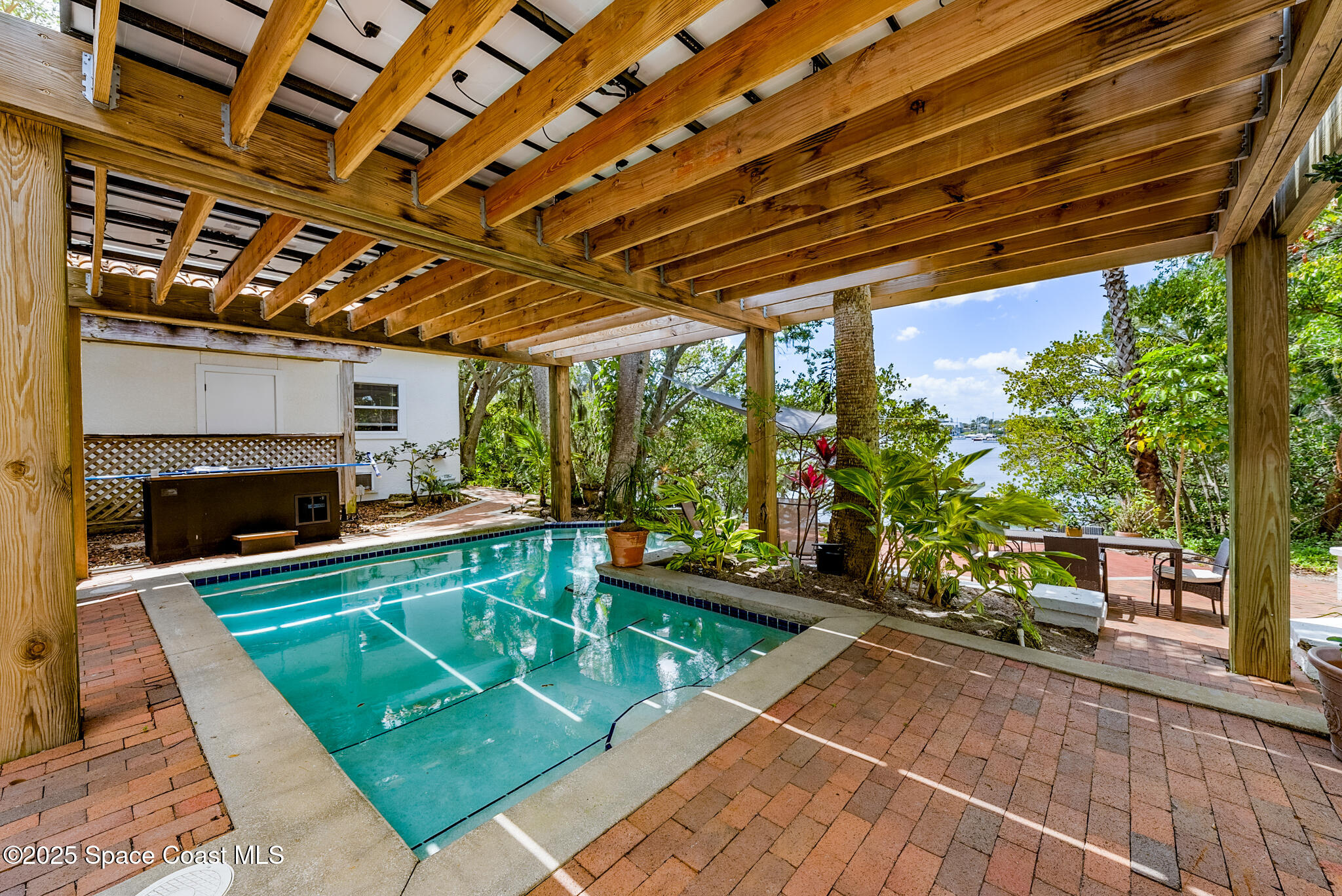 1025 Terry Drive Melbourne, FL 32935 - Photo 63 of 72 a room with garden view and a fireplace