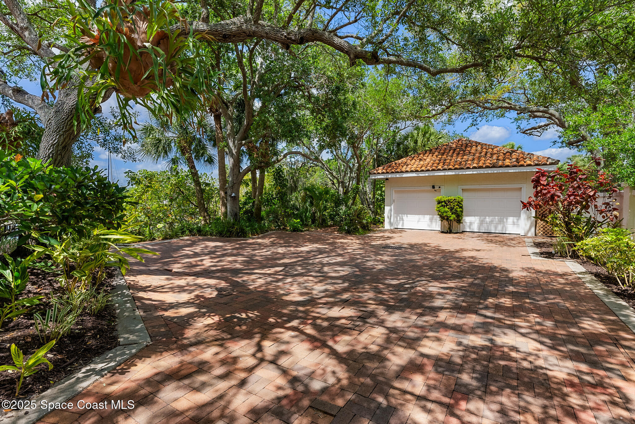 1025 Terry Drive Melbourne, FL 32935 - Photo 69 of 72 a house with a tree in front of it