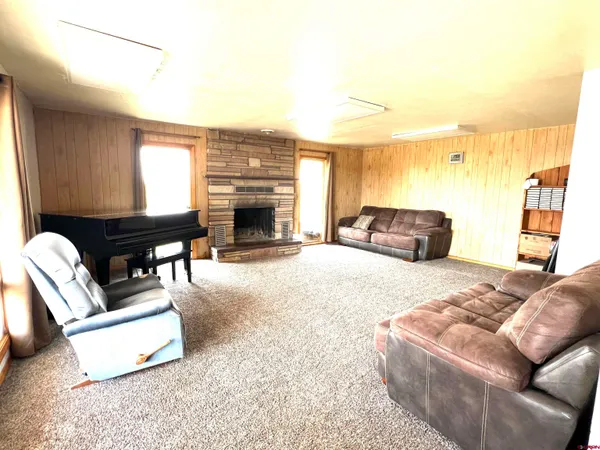 a kitchen with stainless steel appliances granite countertop a refrigerator a stove and a sink