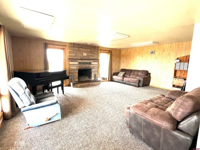 a kitchen with stainless steel appliances granite countertop a refrigerator a stove and a sink