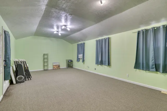 a view of a livingroom with a staircase