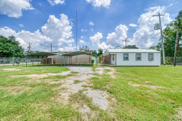 a view of a house with a big yard