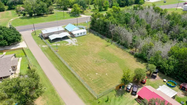 an aerial view of residential houses with outdoor space