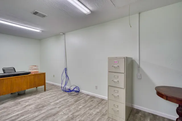 a view of a livingroom with wooden floor
