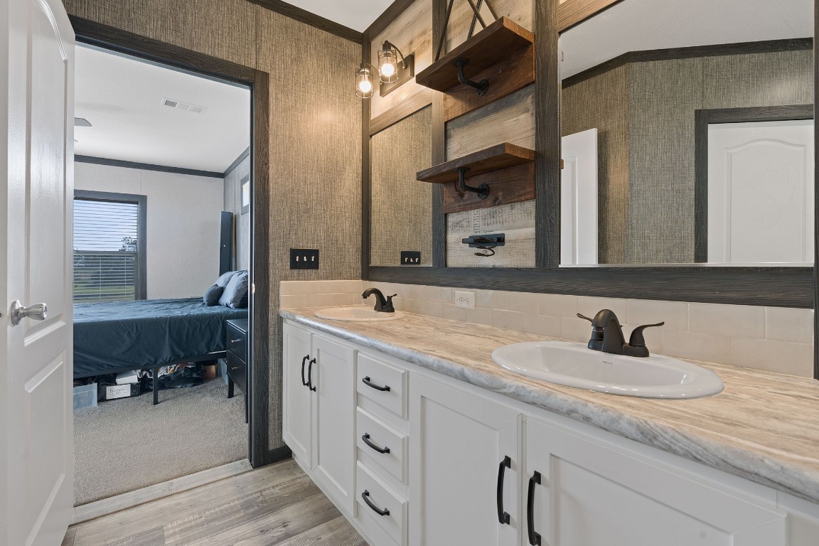 5897 Old Colony Line Road Lockhart, TX 78644 - Photo 13 of 40 a bathroom with a sink and a mirror