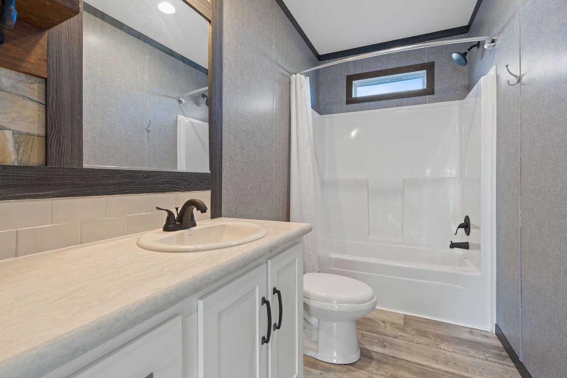 5897 Old Colony Line Road Lockhart, TX 78644 - Photo 17 of 40 a bathroom with a sink toilet a shower and a mirror