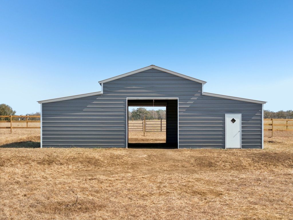 5897 Old Colony Line Road Lockhart, TX 78644 - Photo 19 of 40 a house with a yard