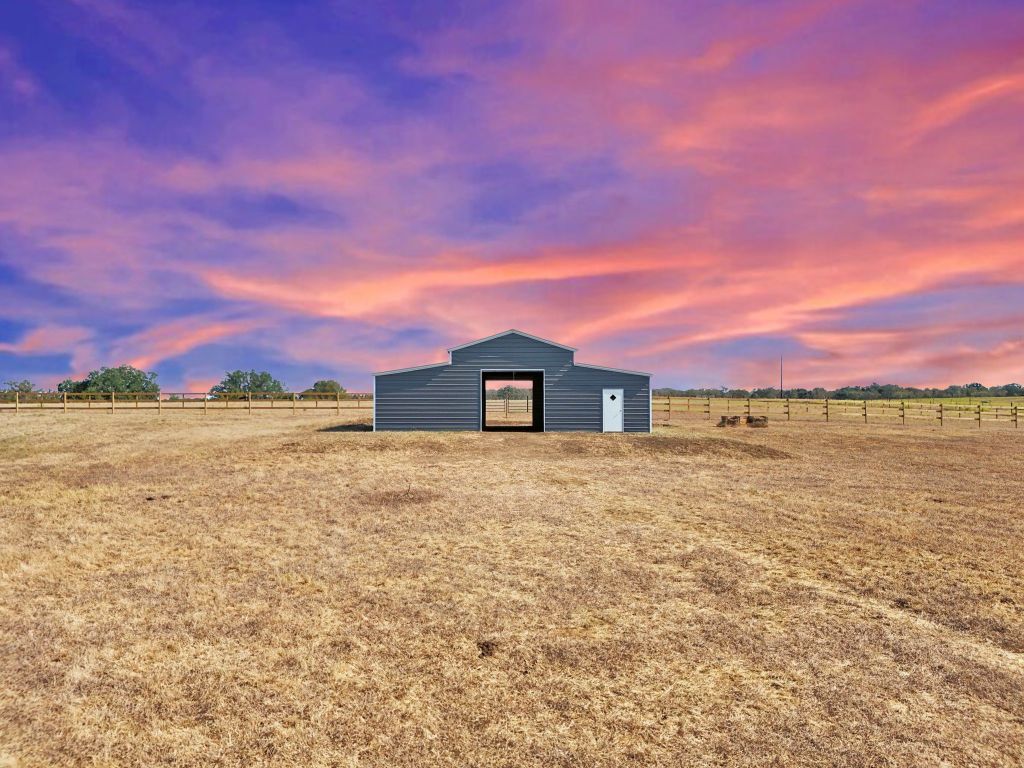 5897 Old Colony Line Road Lockhart, TX 78644 - Photo 21 of 40 a view of a large body of water next to a building
