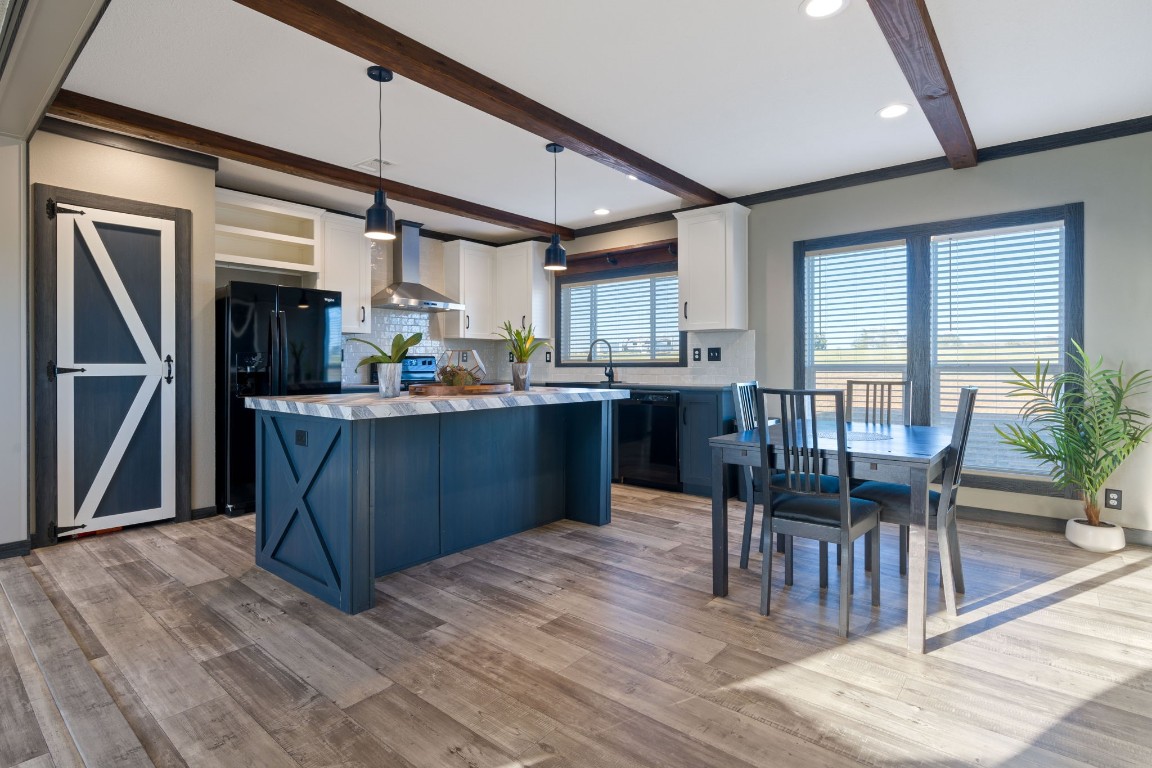 5897 Old Colony Line Road Lockhart, TX 78644 - Photo 5 of 40 a kitchen with stainless steel appliances granite countertop a table chairs refrigerator and sink