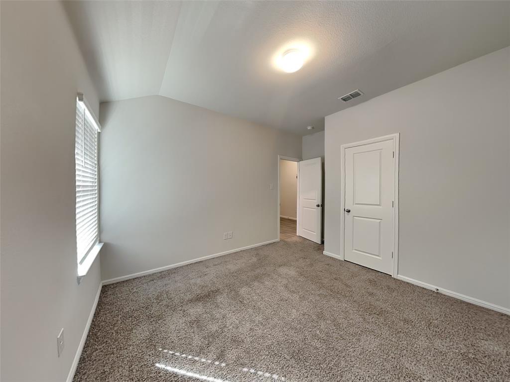 2313 Marshville Road Fort Worth, TX 76108 - Photo 13 of 17 an empty room with windows and closet