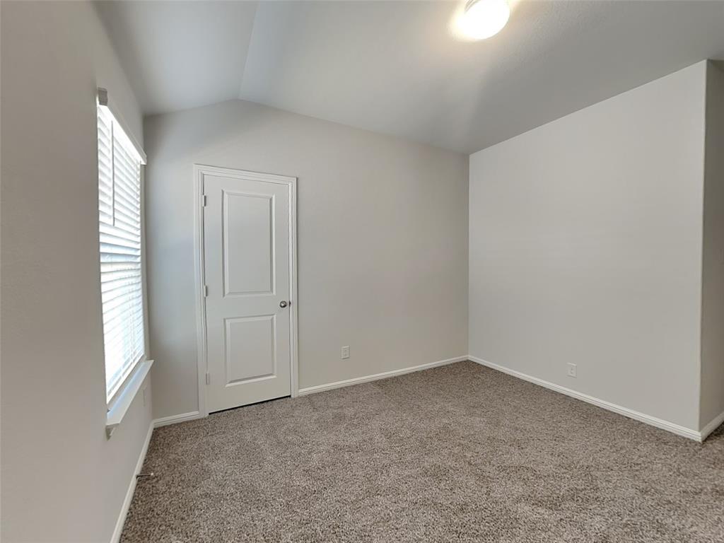 2313 Marshville Road Fort Worth, TX 76108 - Photo 14 of 17 an empty room with windows