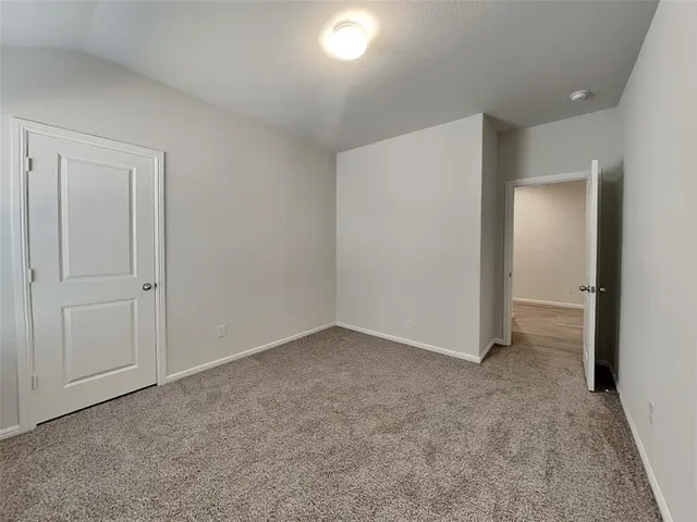 an empty room with closet area