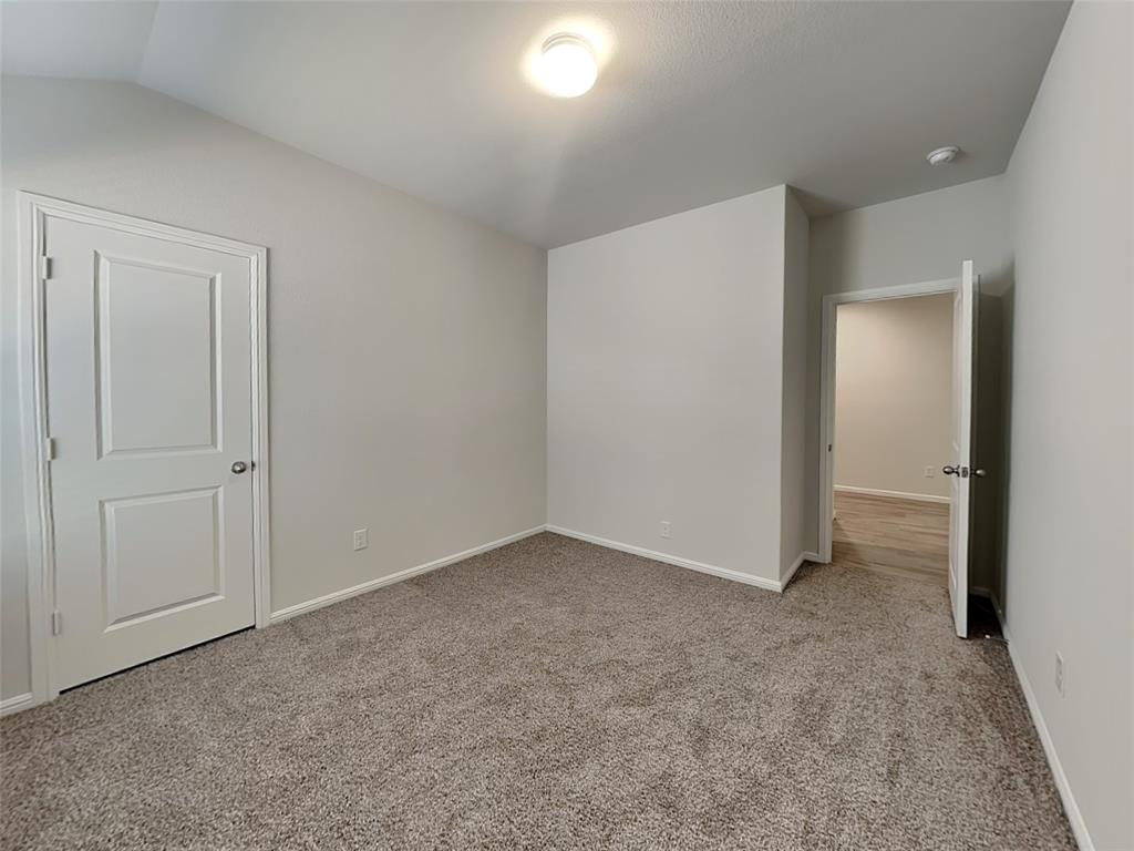 2313 Marshville Road Fort Worth, TX 76108 - Photo 15 of 17 an empty room with closet area