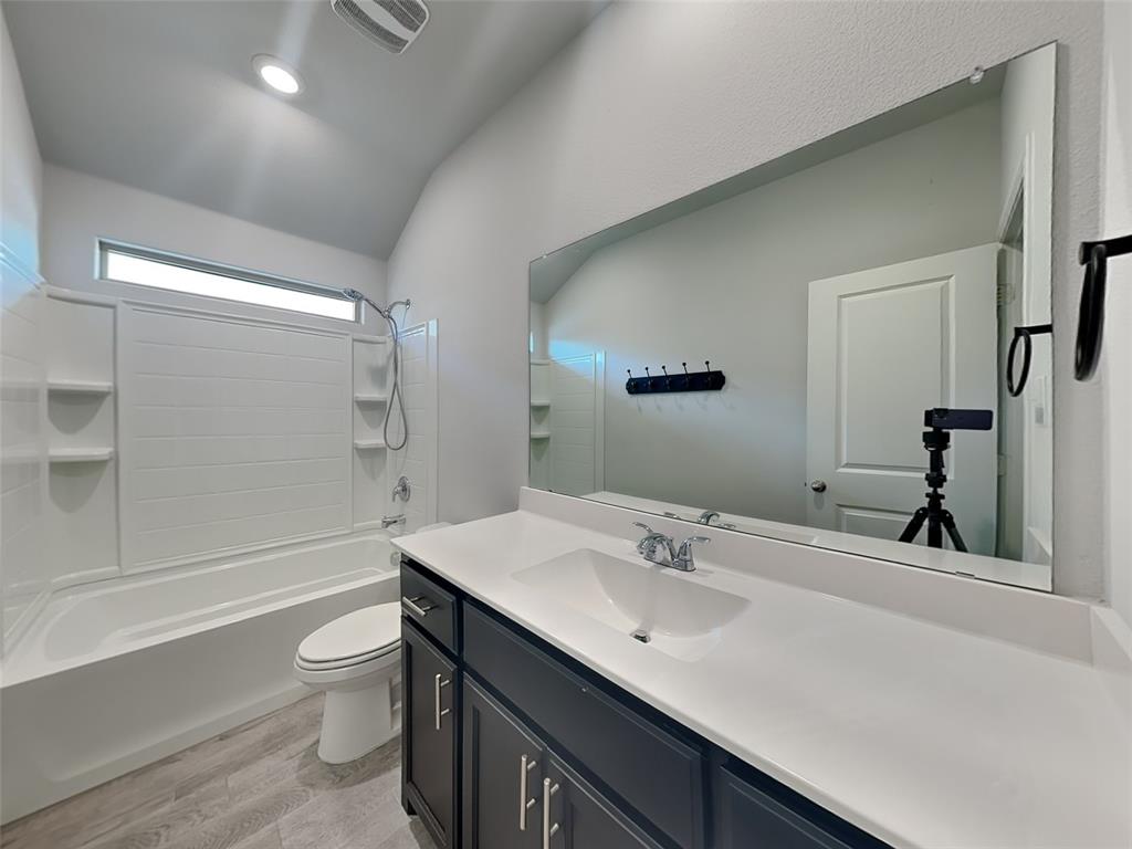2313 Marshville Road Fort Worth, TX 76108 - Photo 16 of 17 a bathroom with a sink a toilet and shower