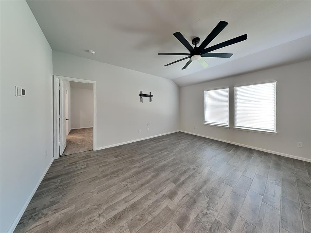 2313 Marshville Road Fort Worth, TX 76108 - Photo 2 of 17 wooden floor in an empty room with a window
