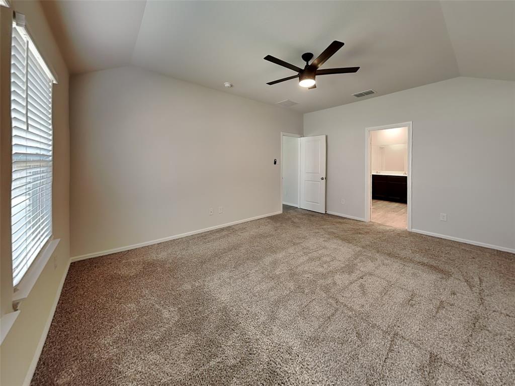 2313 Marshville Road Fort Worth, TX 76108 - Photo 8 of 17 an empty room with ceiling fan and window