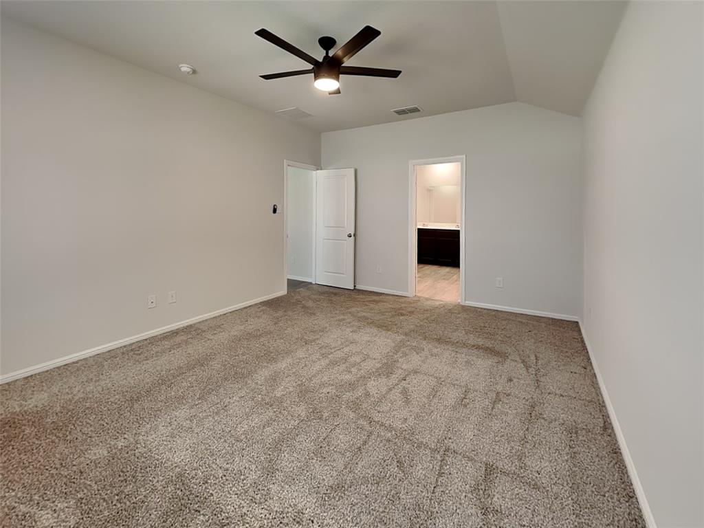 2313 Marshville Road Fort Worth, TX 76108 - Photo 9 of 17 an empty room with a ceiling fan and a window