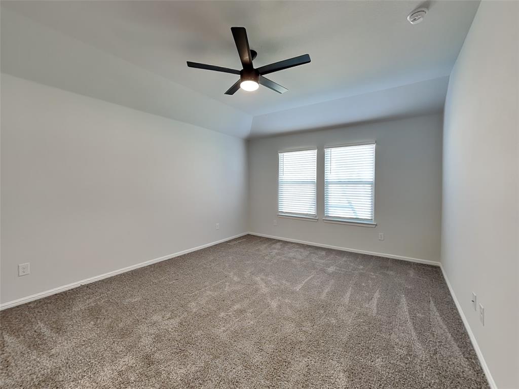 2313 Marshville Road Fort Worth, TX 76108 - Photo 10 of 17 a view of a livingroom with a ceiling fan and window