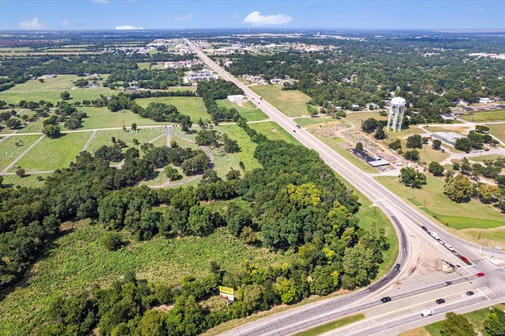 604 State Highway 121 Bonham, TX 75418 - Photo 3 of 21 an aerial view of a residential houses with outdoor space and trees
