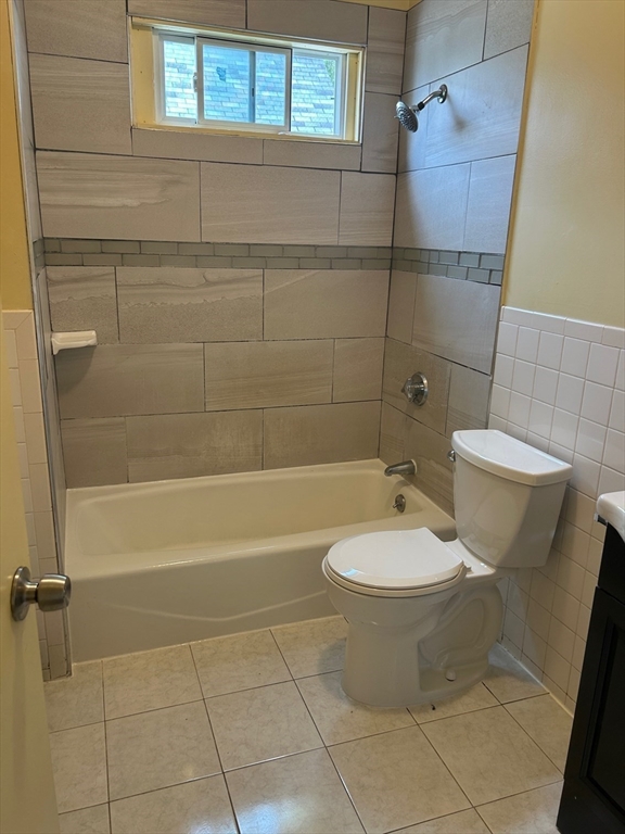 15 Harlem Street, Unit 3 Boston, MA 02121 - Photo 13 of 14 a bathroom with a toilet a sink and bathtub