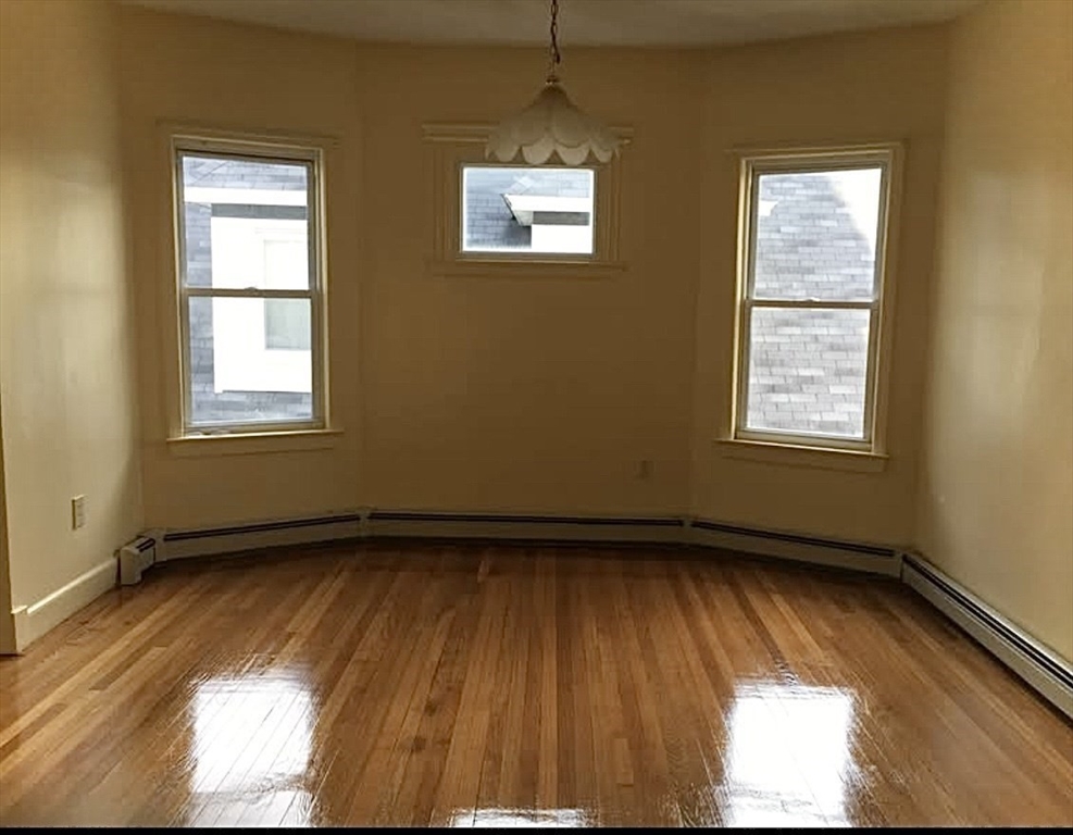 15 Harlem Street, Unit 3 Boston, MA 02121 - Photo 2 of 14 a view of an empty room and a window