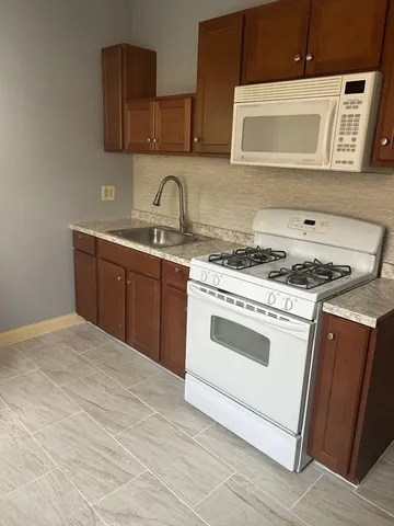 a kitchen with a stove and a sink