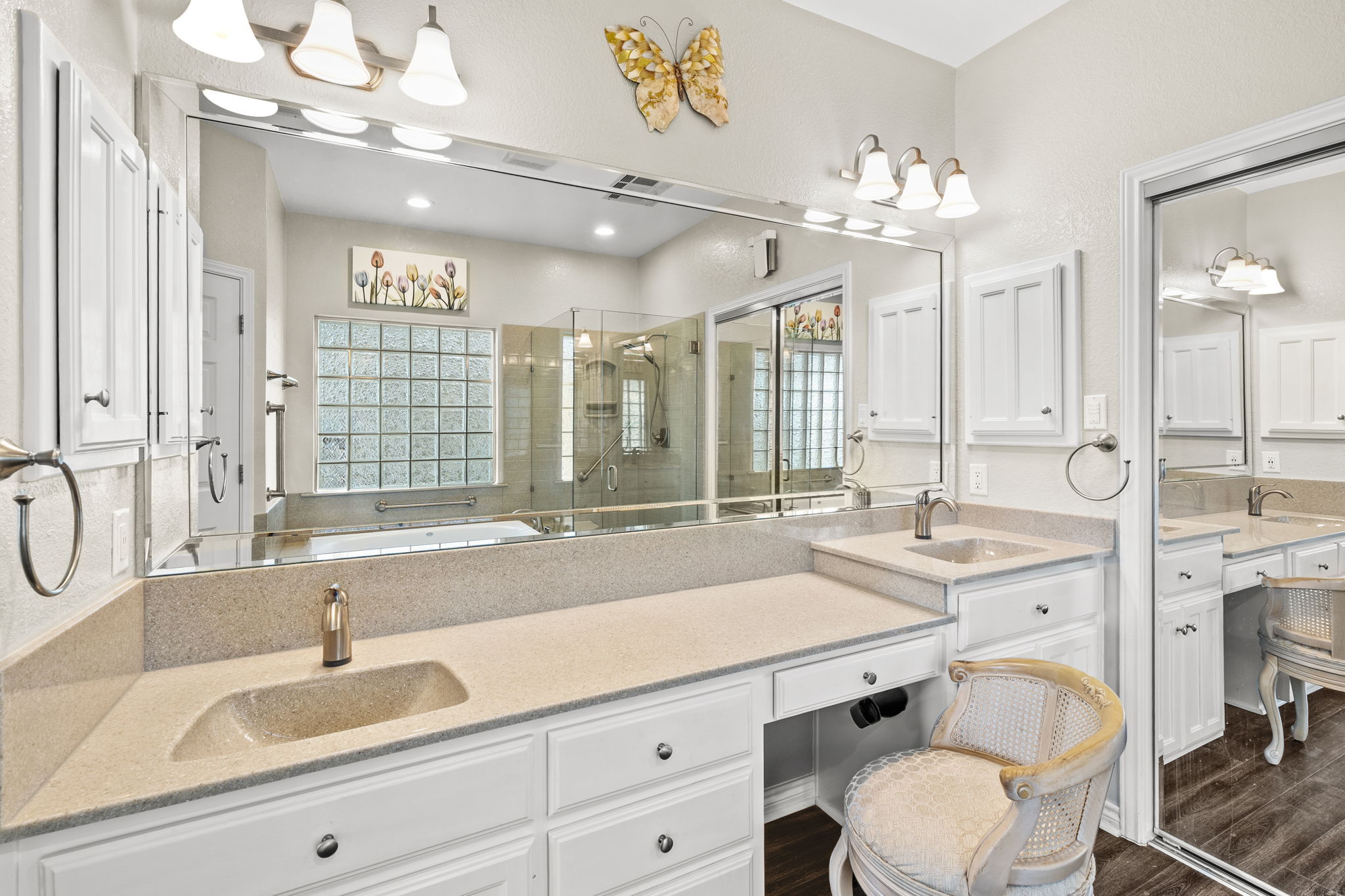 1427 River Ridge Ranch Road Killeen, TX 76549 - Photo 18 of 40 Dual vanity with integrated sinks, a built-in makeup counter, and a glass-enclosed shower create a practical primary bath.