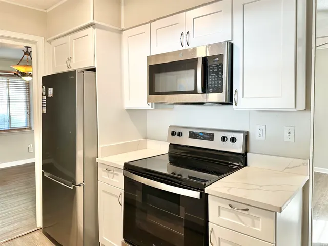 a kitchen with a stove and a microwave