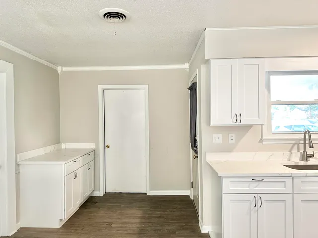 a bathroom with a sink a mirror and a shower