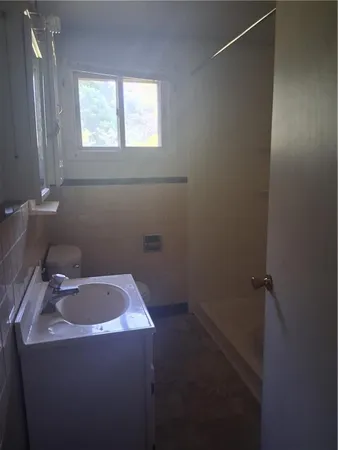 a bathroom with a sink and vanity