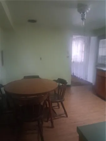 a room with a table and chairs