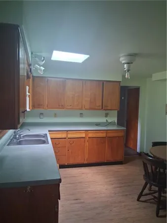 a kitchen with an oven table and chairs