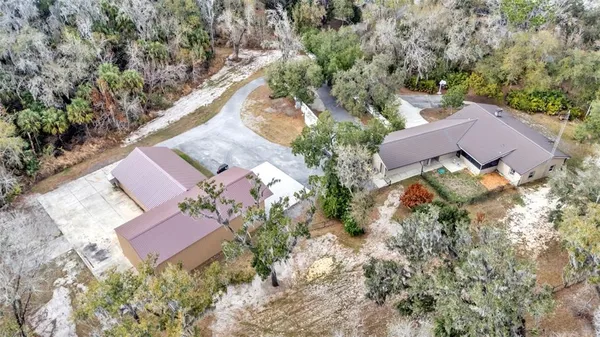 an aerial view of house with yard