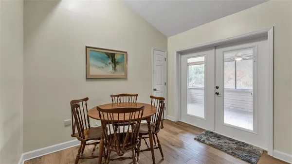 a bedroom with a bed couch and a window