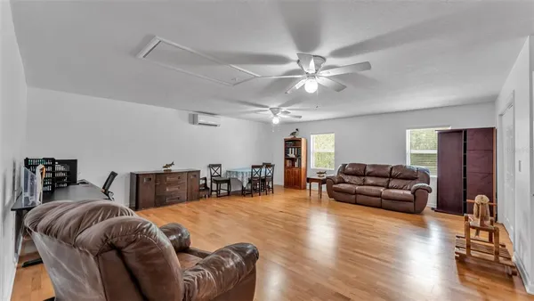 a view of a livingroom with workspace and a couch
