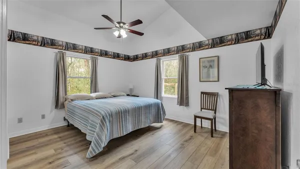 a bedroom with a bed and window