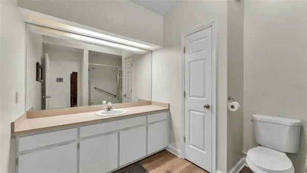 a bathroom with a shower and a toilet