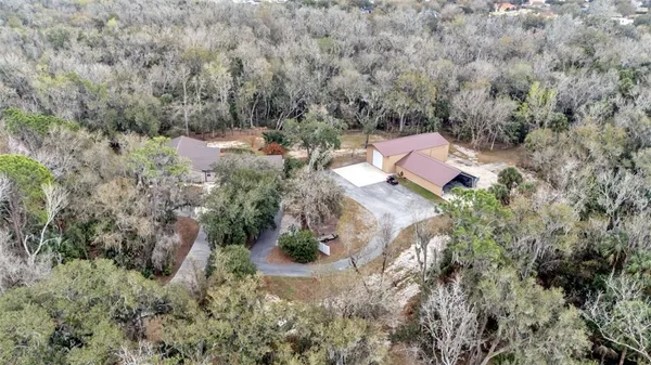 an aerial view of residential house with outdoor space