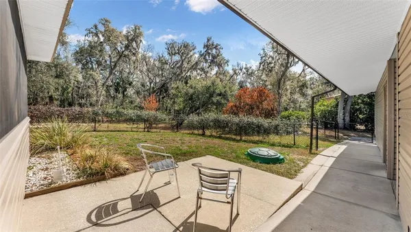 a house that has a tree in front of it