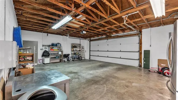 a view of a house with a yard and garage