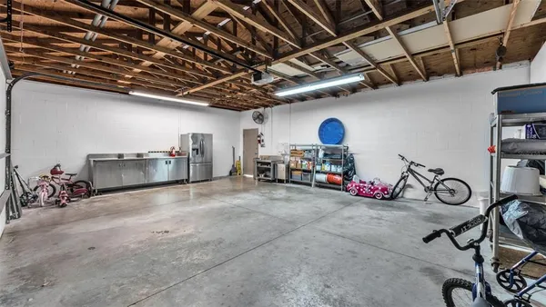 a view of a house with a outdoor space and trees