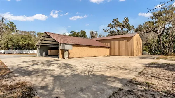 an aerial view of house with yard and mountain view