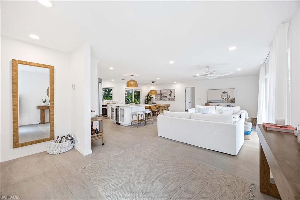 24 Rivard Road Naples, FL 34112 - Photo 7 of 33 a living room with furniture and a bathroom
