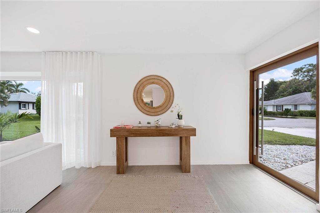 24 Rivard Road Naples, FL 34112 - Photo 8 of 33 a view of a bedroom with furniture and window